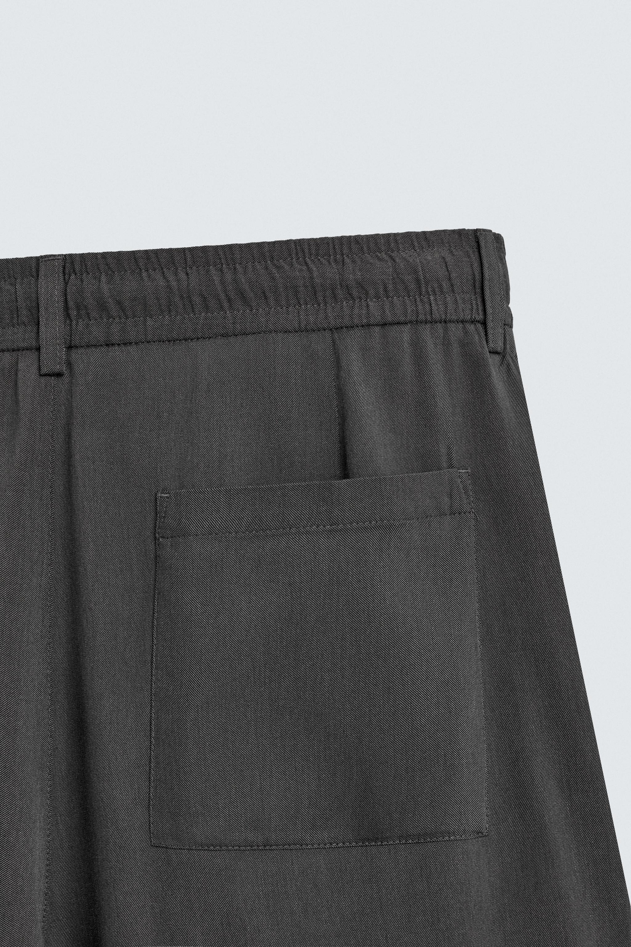 FLOWY PLEATED PANTS